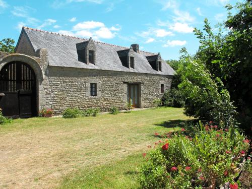 an old stone house with a yard at Holiday Home La Grange - LOY110 by Interhome in Pont-lʼAbbé