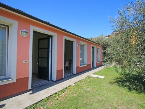 a row of houses with their doors open at Apartment Borgoverde-2 by Interhome in Imperia