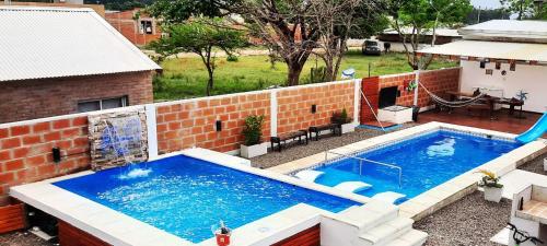 an overhead view of a swimming pool in a backyard at H2o apart in Federación