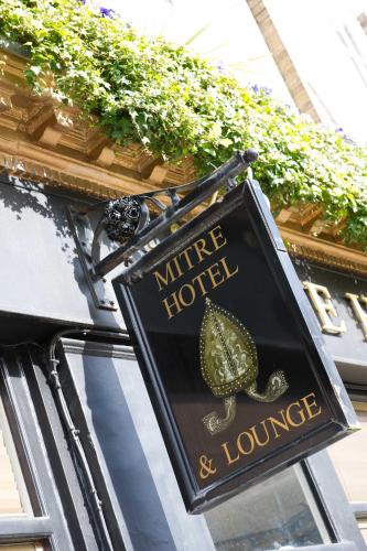 a sign for a hotel with a lizard on it at The Mitre by Innkeeper's Collection in London