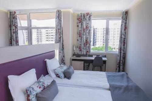 
Een bed of bedden in een kamer bij MPM Astoria Hotel - Ultra All Inclusive
