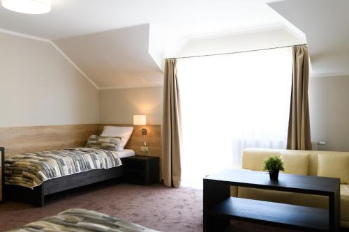 Ein Bett oder Betten in einem Zimmer der Unterkunft Vinařství U Kapličky