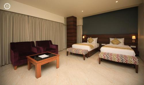 Ένα ή περισσότερα κρεβάτια σε δωμάτιο στο Hotel Daani Continental