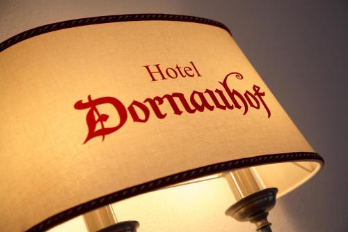 a hotel durham sign on the side of a lamp shade at Hotel Dornauhof in Finkenberg
