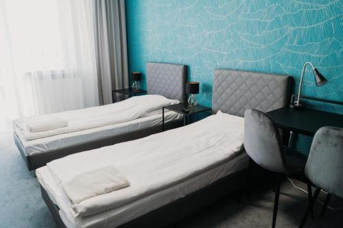 Postel nebo postele na pokoji v ubytování Hotel Kinga