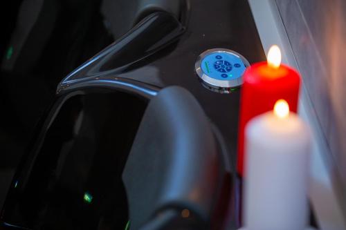 a close up of a car mirror with two candles at B&B Piazza Duomo in Cerignola