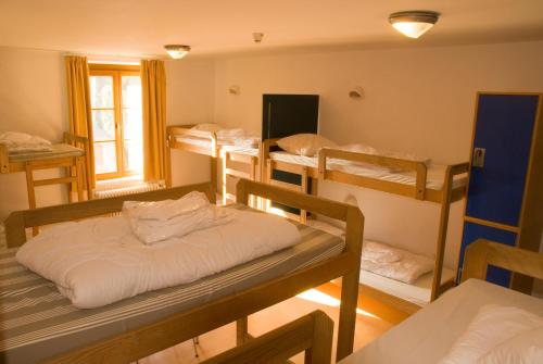 Postel nebo postele na pokoji v ubytování Youth Hostel Vianden