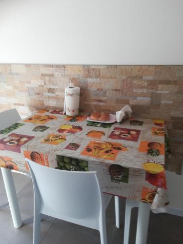 a table with a table cloth on top of it at Gorizia vacanze appartamento in villa con parcheggio in Gorizia