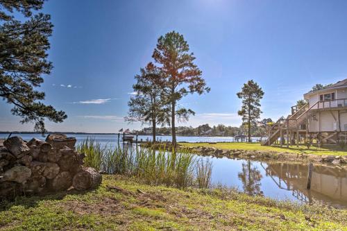 a house on the shore of a lake at Riverfront New Bern House Gourmet Kitchen and View! in New Bern