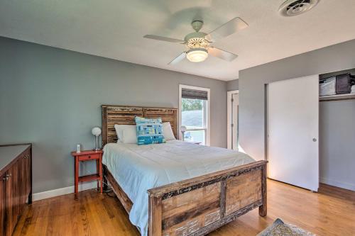 a bedroom with a bed and a ceiling fan at Riverfront New Bern House Gourmet Kitchen and View! in New Bern