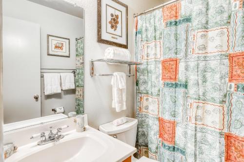 a bathroom with a sink and a toilet and a shower curtain at Incline Oasis in Incline Village