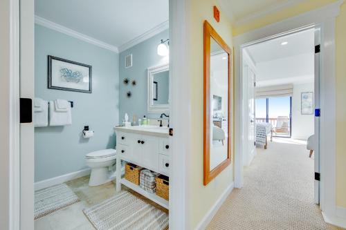 a bathroom with a sink and a toilet and a mirror at Seascape Sanctuary in Aptos