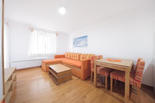 a living room with a couch and a table at Vila Bjanka in Zlatibor