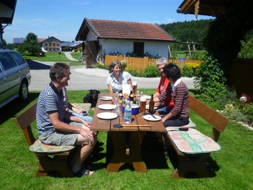 a group of people sitting at a picnic table at Beim Appertinger in Truchtlaching
