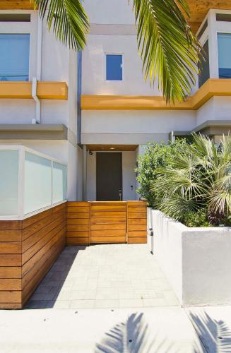 a house with a wooden fence in front of it at Hollywood’s Suite in Los Angeles