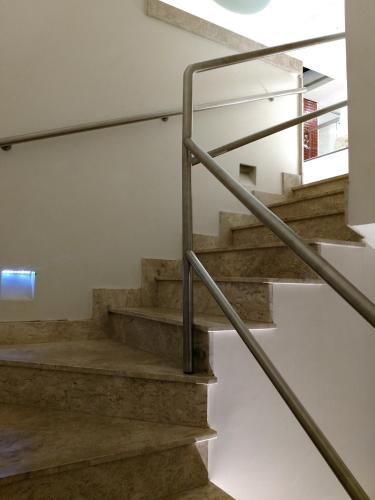 a staircase in a house with concrete stairs at A2 suites - Hotel e Motel in Brasilia