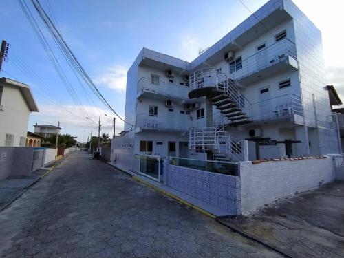 a white building with stairs on the side of it at Solar Dona Maria in Pinheira