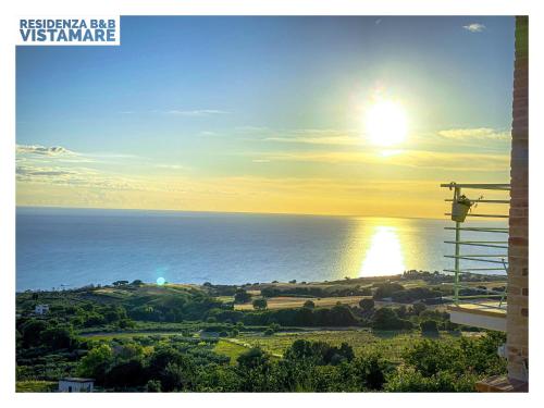 a view of the ocean with the sun in the sky at Residenza B&B VistaMare in Petacciato