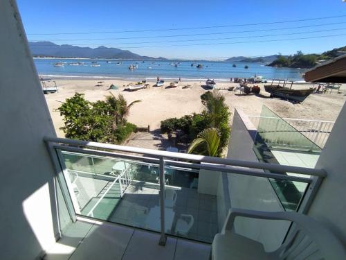 a balcony with a view of a beach at Solar Dona Maria in Pinheira