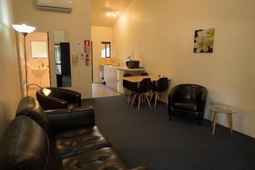 Zona de estar de Captains Quarters Motor Inn