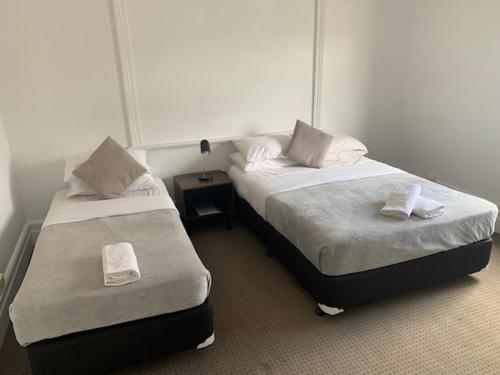 Cama o camas de una habitación en Manly Beach Guesthouse