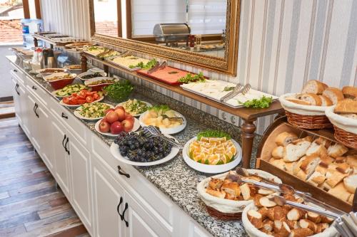 a buffet line with many different types of food at Beyazit Palace Hotel in Istanbul