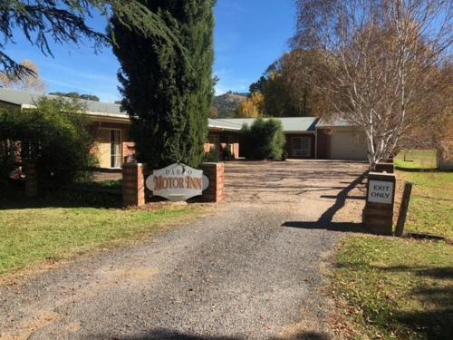 a house with a sign in front of a driveway at Dargo Hotel in Dargo