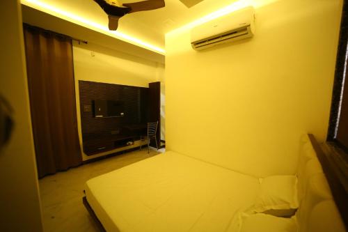 a small bedroom with a bed and a window at Hotel Byke Ride - Walkable from Agra Cantt Railway Station in Agra