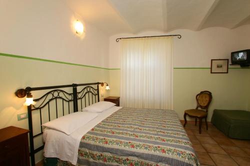 Un pat sau paturi într-o cameră la Le Camere Di Paolino