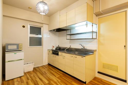 Una cocina o zona de cocina en Stay Hakata