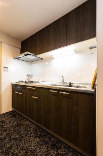 Una cocina o zona de cocina en Stay Hakata