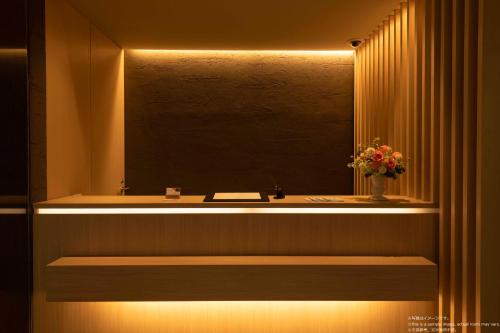 a bathroom with a sink and a mirror at Stay SAKURA Kyoto Fuga in Kyoto