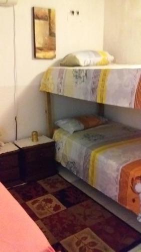 Двуетажно легло или двуетажни легла в стая в Room in Apartment - Comfortable inn Green Sea Villa Helen Kilometro 4 Circunvalar