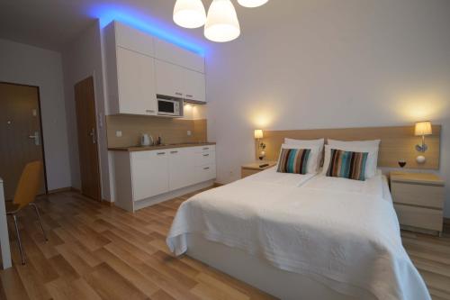 Cama o camas de una habitación en Apartamenty Karawela - Nadmorski Dwór