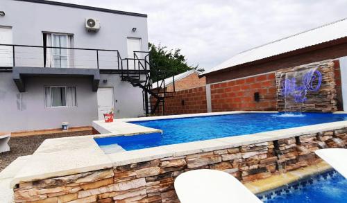 a swimming pool in the backyard of a house at H2o apart in Federación