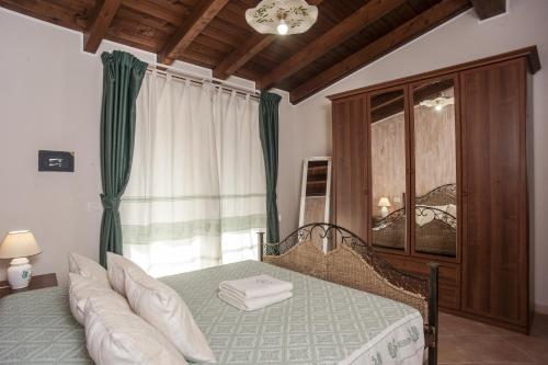 Tempat tidur dalam kamar di Sobìa Pitticca