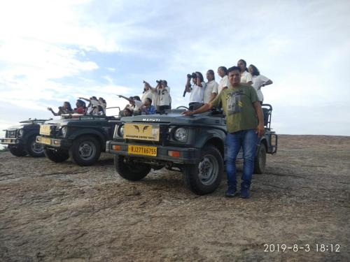 a group of people riding in the back of a jeep at HARIYALI RESORT in Sardārgarh