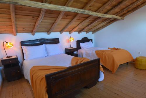 En eller flere senger på et rom på Quinta da Fonte em Moncarapacho