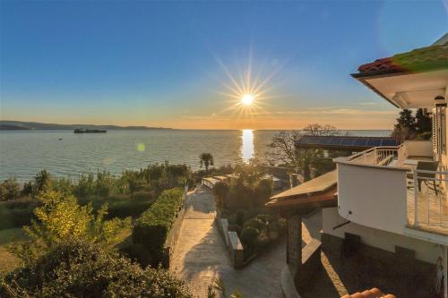 a view of the water from a house at Debeli Rtič Apartments - Happy Rentals in Ankaran