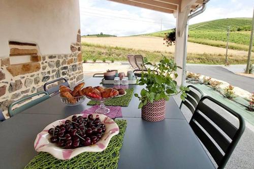 a table with a plate of food on top of it at Domaine de Solémy in Bully