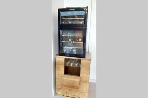 a refrigerator is shown through a doorway at Domaine de Solémy in Bully