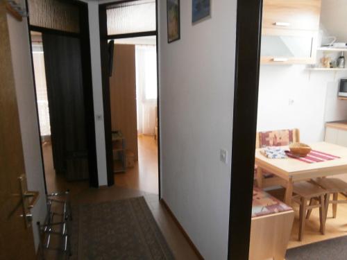 a room with a table and a dining room at Apartment Žvan in Bohinj