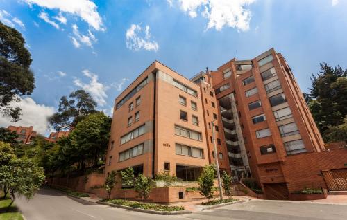 
a large brick building with a large window at Mika Suites in Bogotá
