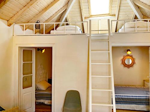a bunk bed in a room with two bunk beds at Casa Pescador Peniche in Peniche