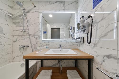 Ванная комната в Отель Аэростар