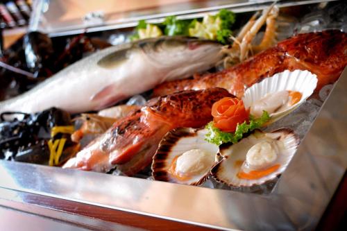 a bunch of different types of seafood on display at Hotel Marko in Portorož