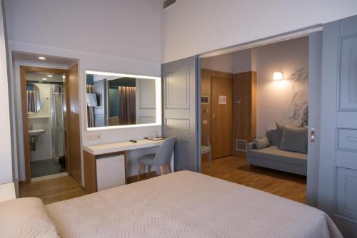Byzantino Hotel tesisinde bir odada yatak veya yataklar