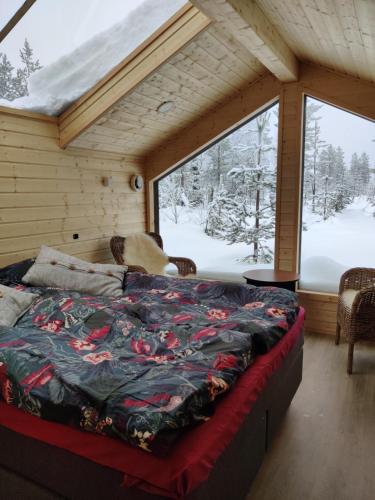 Katil atau katil-katil dalam bilik di Polar Lights Lodge