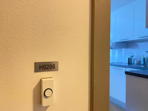 a door with a sign that says hovo on it at The beautiful Verven 2A in Stavanger