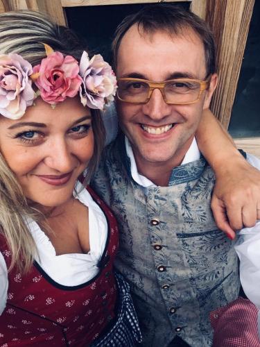 a man and a woman posing for a picture at Restaurant Gästehaus Wiesenheim in Uderns